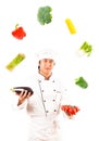 Cook Juggling With Vegetables Royalty Free Stock Photo