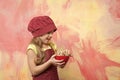 Cook kid in chef hat, apron hold cookies or biscuits Royalty Free Stock Photo