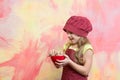 Cook kid in chef hat, apron hold cookies or biscuits Royalty Free Stock Photo