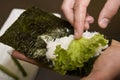 Cook on kitchen prepares Japanese susi