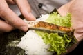 Cook on kitchen prepares Japanese susi