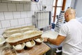 Russia, Moscow,10.06.2019, the cook makes slices of dough and puts in a row in a bowl, pastries, flour products Royalty Free Stock Photo