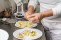 Cook peeling apples in the kitchen Royalty Free Stock Photo