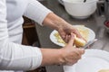 Cook peeling apples in the kitchen Royalty Free Stock Photo