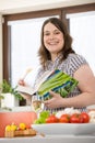 Cook - Plus size happy woman holding cookbook