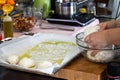 The cook prepares buns from yeast dough and spreads on a baking Royalty Free Stock Photo