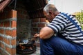 The cook prepares food in natur