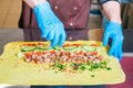 Cook prepares a shawarma. Ingredients