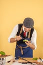 Cook preparing burger adding the sauce on green bun. Royalty Free Stock Photo