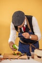 Cook preparing burger adding the sauce on green bun. Royalty Free Stock Photo