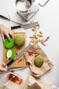 Cook preparing burger adding the sauce on green bun. Royalty Free Stock Photo