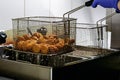 The cook preparing fresh Falafel balls fries