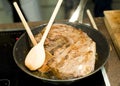 Cook preparing fresh roast meat