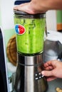 Cook preparing green puree