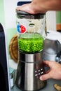 Cook preparing green puree