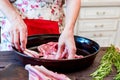 Cook puts raw lamb ribs on frying pan close up Royalty Free Stock Photo