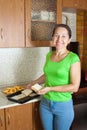 Cook puts toast bread into roasting pan