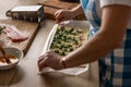 The cook rolls puff pastry with bacon, spinach and cheese, prepares mini pizza cakes Royalty Free Stock Photo