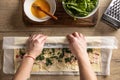 The cook rolls puff pastry with bacon, spinach and cheese, prepares mini pizza cakes Royalty Free Stock Photo