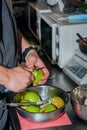 Cook`s hands clean the pear. Preparation of the pears to caramelize and cook chutney. Close up Royalty Free Stock Photo