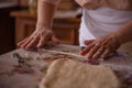 Cook's hands kneading dough for cakes. Preparing the flour for leavening Royalty Free Stock Photo