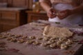 Cook's hands kneading dough for cakes. Preparing the flour for leavening Royalty Free Stock Photo