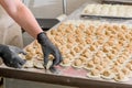 Cook sculpts dumplings. Production of dumplings and ravioli with various fillings