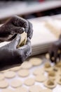 Cook sculpts dumplings. Production of dumplings and ravioli with various fillings