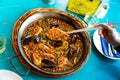 Cook serving seafood paella Royalty Free Stock Photo