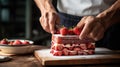 Cook slicing a Japanese strawberry short cake