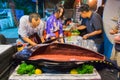 Cook are slicing tuna sashimi on18th Phuket chinese new year day