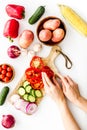 Cook vegetables. Hands cut pepper near autumn harvest on white background top-down Royalty Free Stock Photo