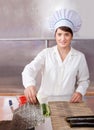 Cook woman making sushi rolls Royalty Free Stock Photo