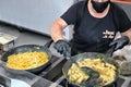 Cook at work preparing typical italian pasta carbonara and cacio e pepe at food festival Rome Italy