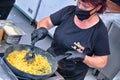 Cook at work preparing typical italian pasta carbonara and cacio e pepe at food festival Rome Italy