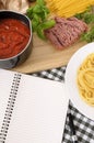 Cookbook with ingredients for Italian spaghetti bolognese, copy space Royalty Free Stock Photo