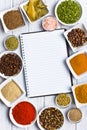 Cookbook and various spices and herbs. Royalty Free Stock Photo