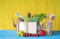 Cookbook, vegetables, kitchen utensils
