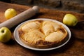 Cooked apple pie on wooden background. Finished semi-finished product