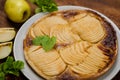 Cooked apple pie on wooden background. Finished semi-finished product