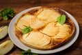 Cooked apple pie on wooden background. Finished semi-finished product