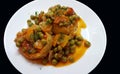 Cooked Artichoke with green peas and carrots