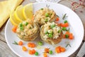 Cooked Artichokes with rice, green peas, carrot and olive oil.