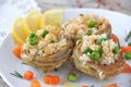 Cooked Artichokes with rice, green peas, carrot and olive oil.