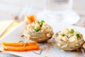 Cooked Artichokes with rice, green peas, carrot and olive oil.