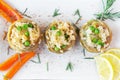 Cooked Artichokes with rice, green peas, carrot and olive oil.