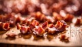 cooked bacon bits on wooden chopping board