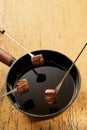 Cooked Beef on Fondue Forks with Pot of Hot Oil Royalty Free Stock Photo