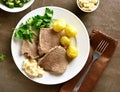 Cooked beef with potatoes and horseradish