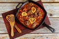 Cooked beef shank with vegetable and wine in cast iron . Italian cuisine Royalty Free Stock Photo